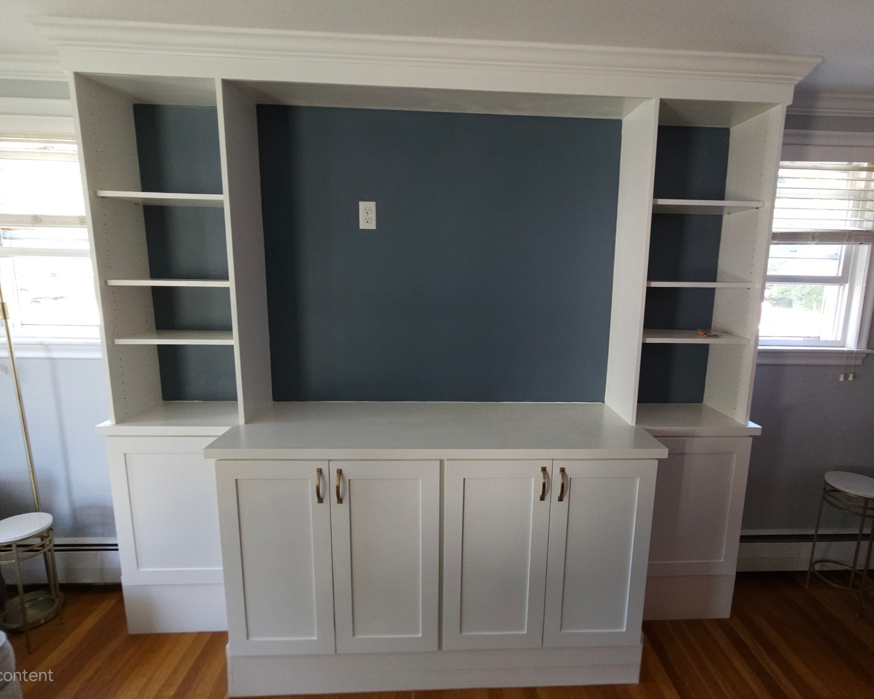 Custom painted built-in cabinets — finish carpentry by Absolute Design Build