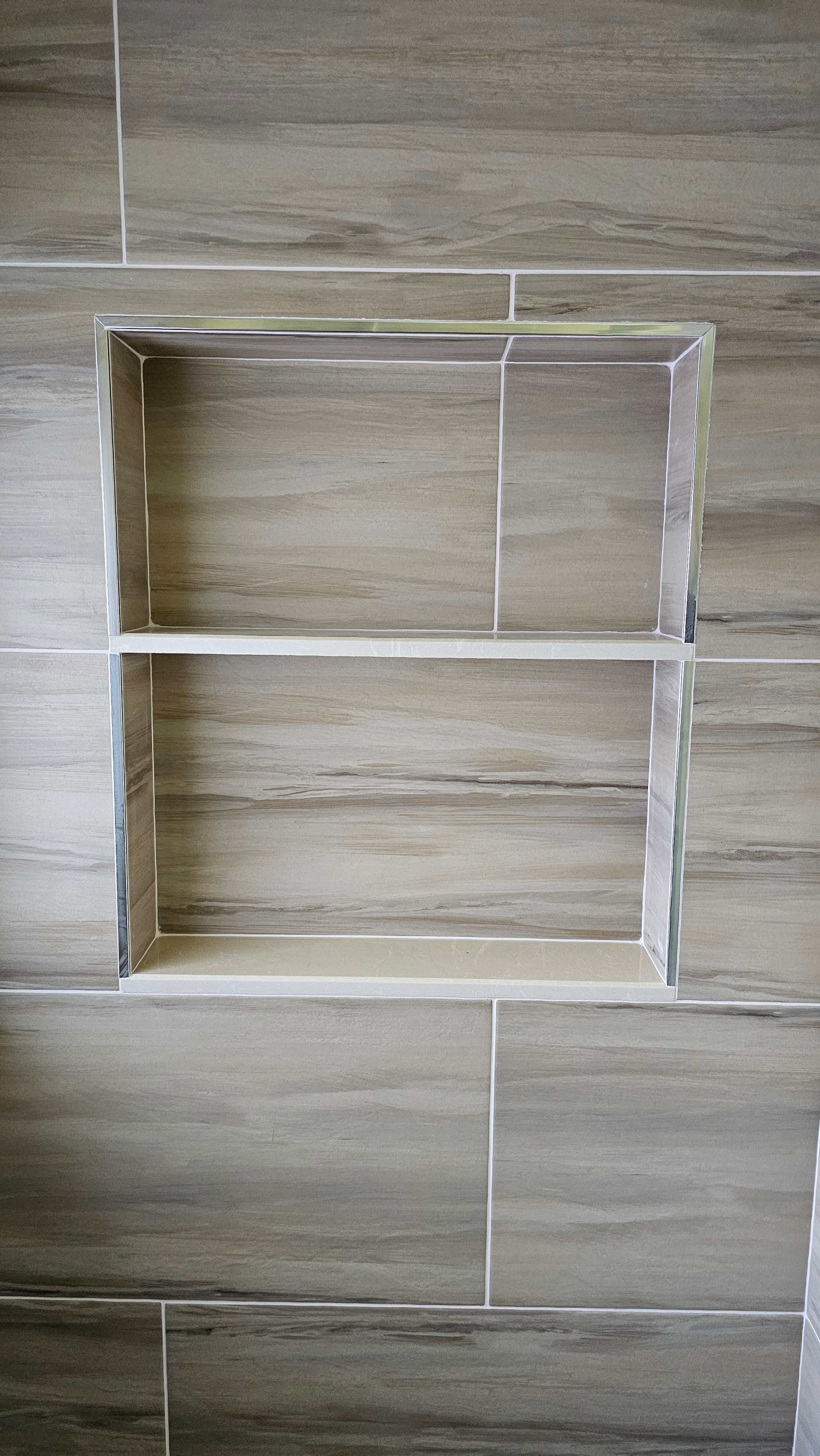 Custom tiled shower niche detail