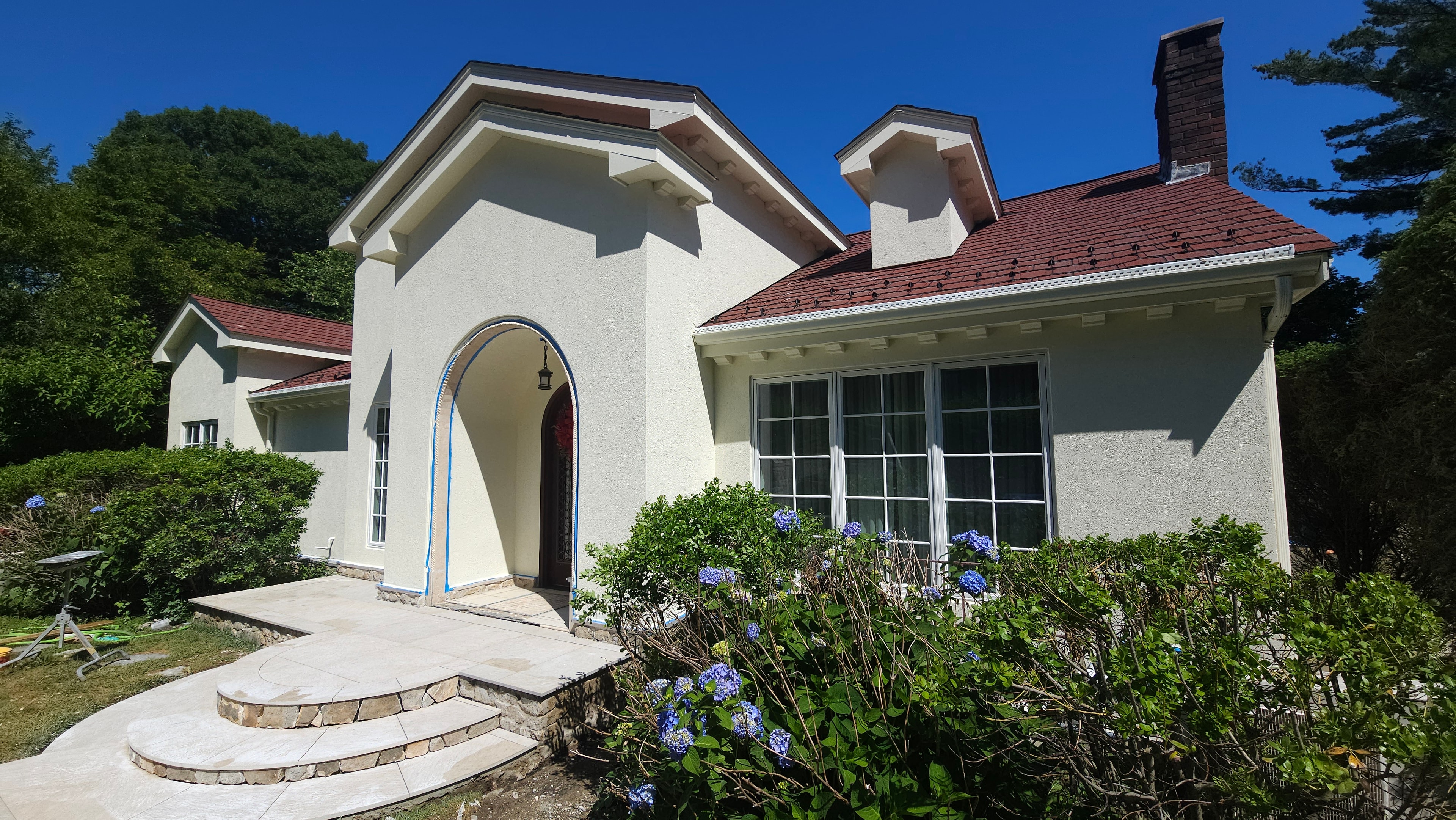 Front entry arch with masking tape — late stage