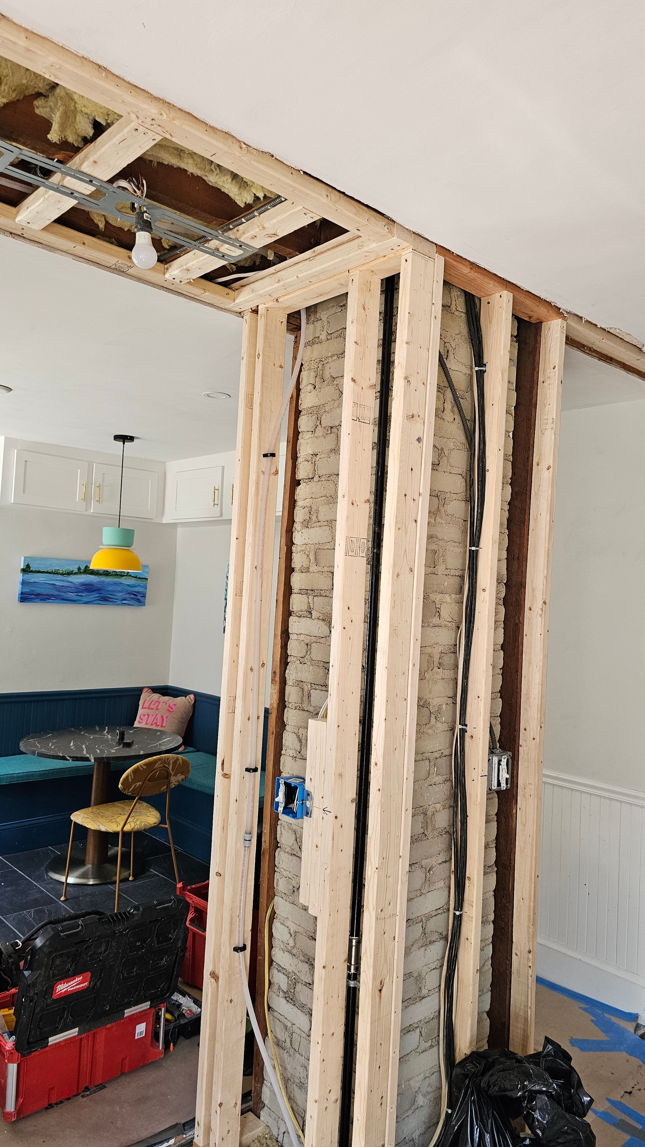 Kitchen demo in progress — walls opened, before new wallboard, West Roxbury MA