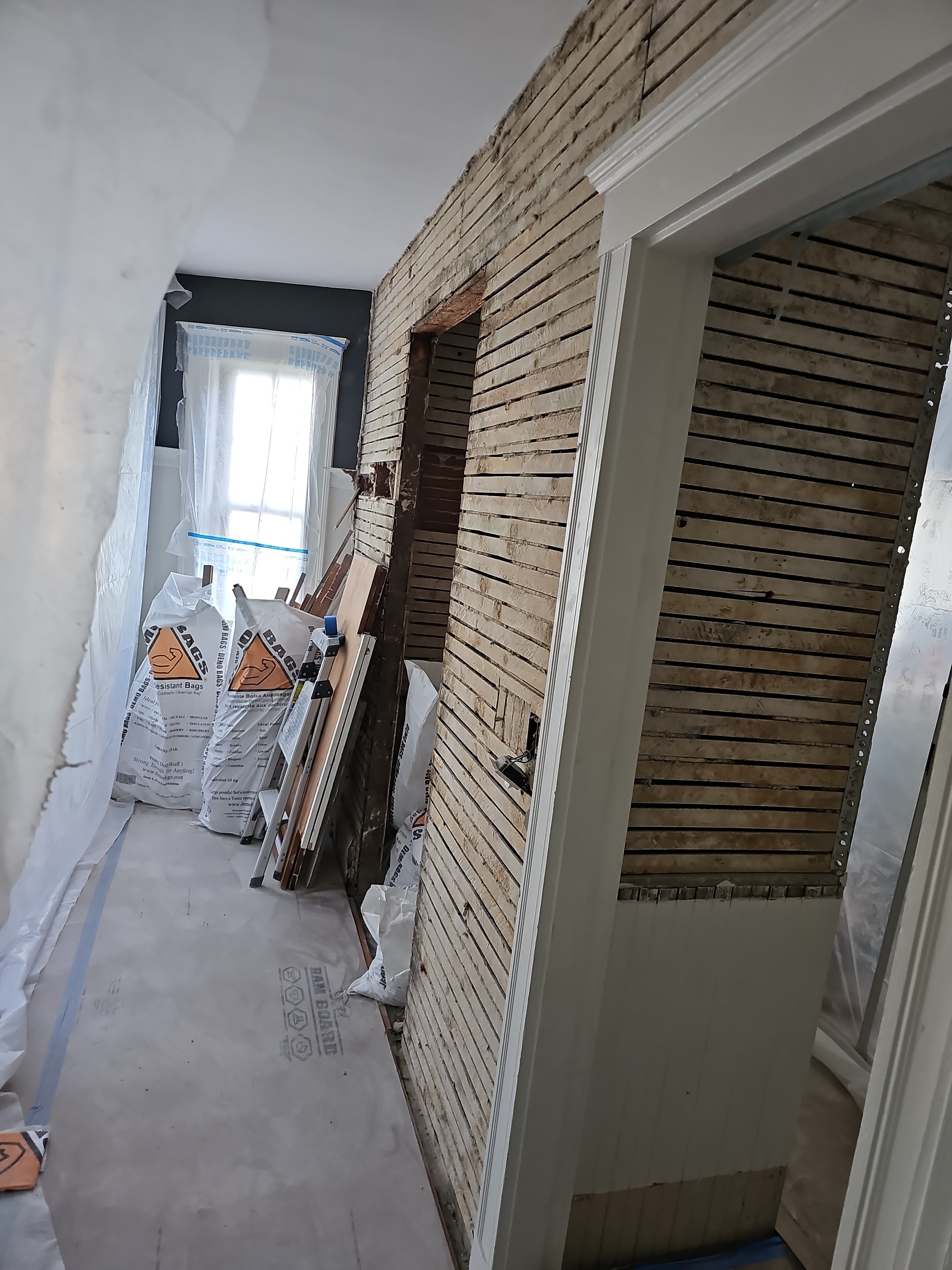 Horse hair plaster removed — kitchen walls stripped to framing