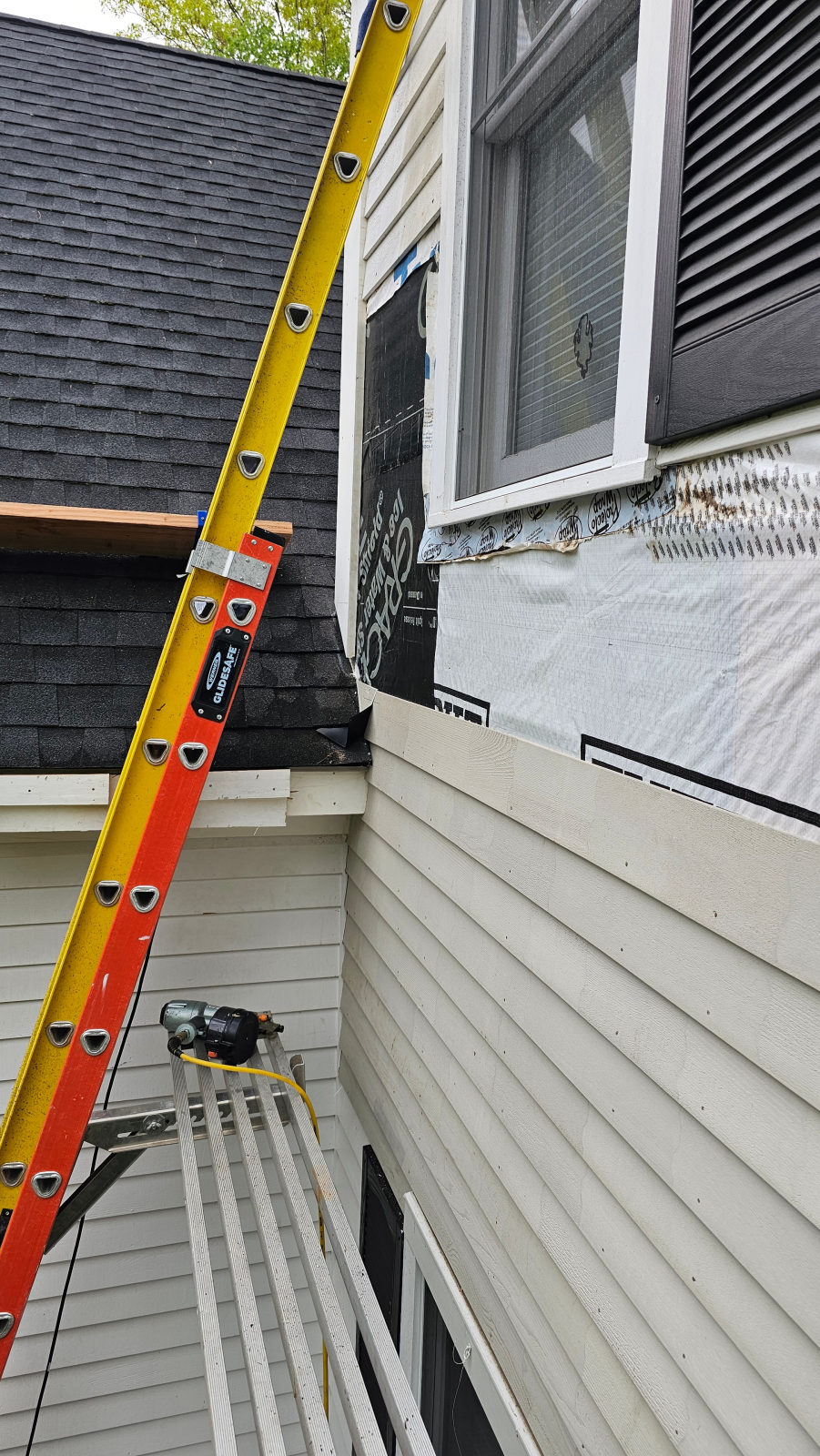 Rotted fascia and soffit exposed during ice dam damage repair — Weston, MA