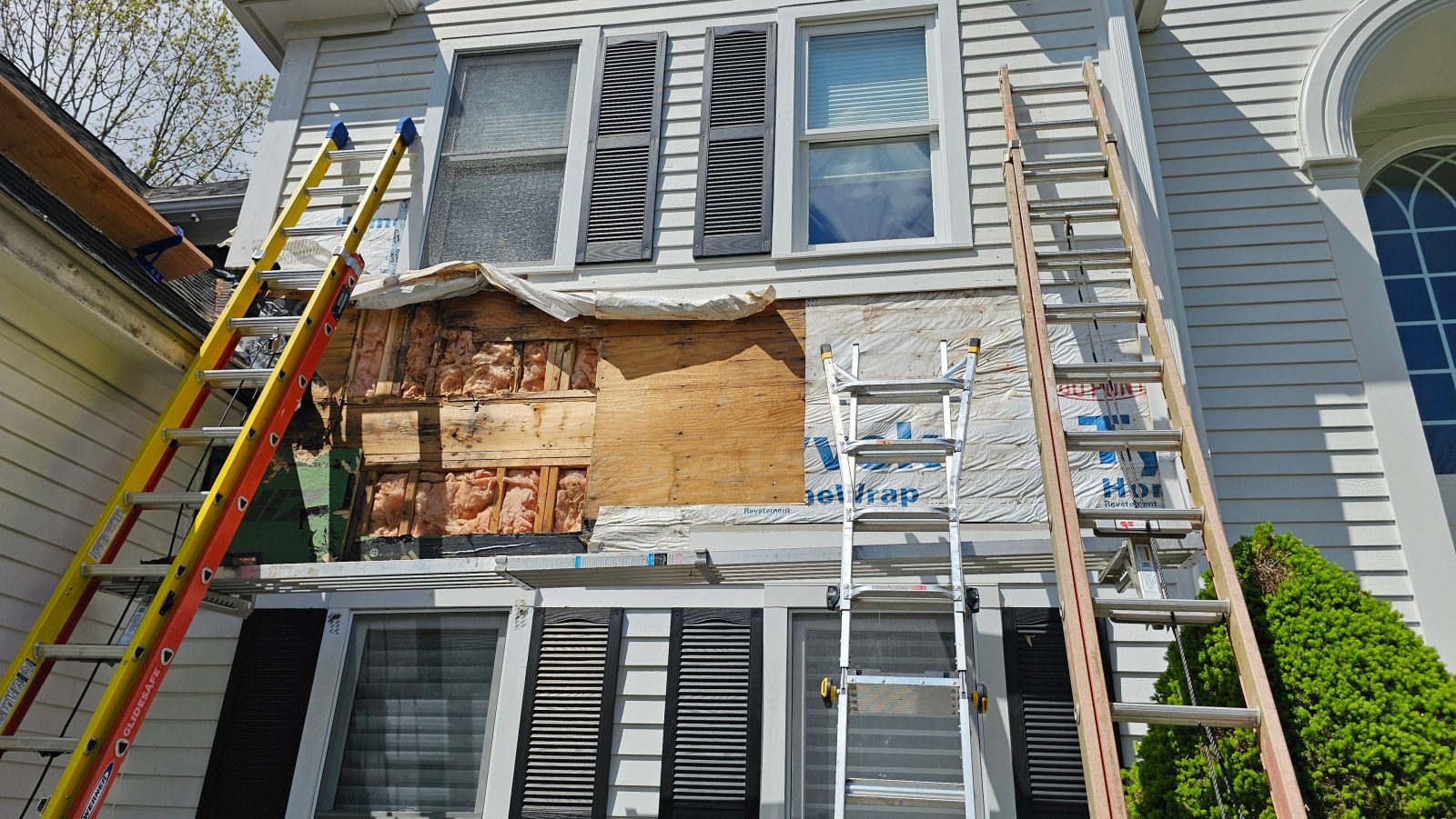 Siding removed exposing sheathing and rot damage during repair — Weston, MA